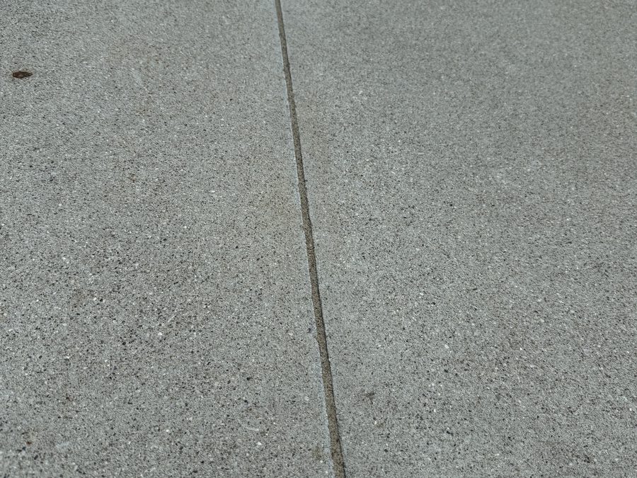 Long driveway expansion joint sealed smooth end to end